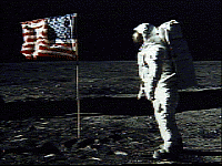 [Astronaut facing flag]