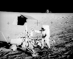 [Pete Conrad standing next to the Surveyor spacecraft]